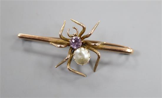 An early to mid 20th century yellow metal, amethyst and mother of pearl set spider bar brooch, 52mm.